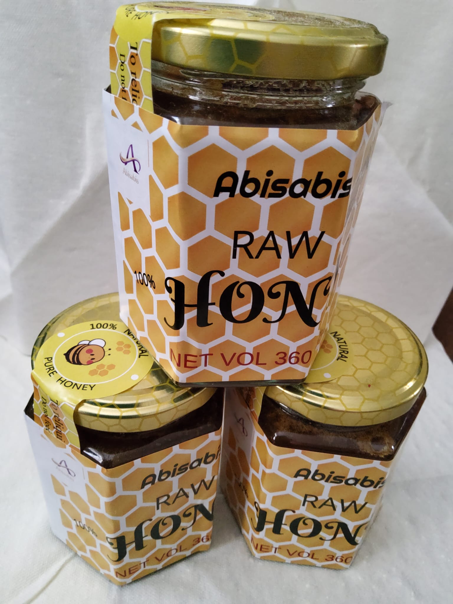 Raw honey in hexagonal jar